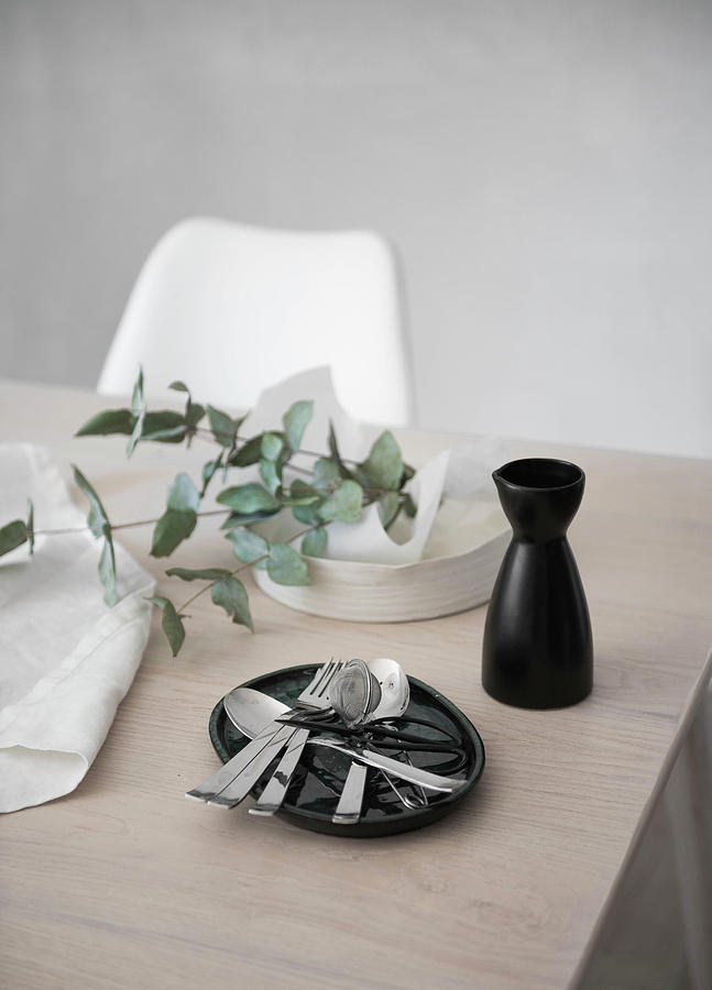 Cutlery, Carafe And Eucalyptus Branch On Table Photograph by Agata Dimmich