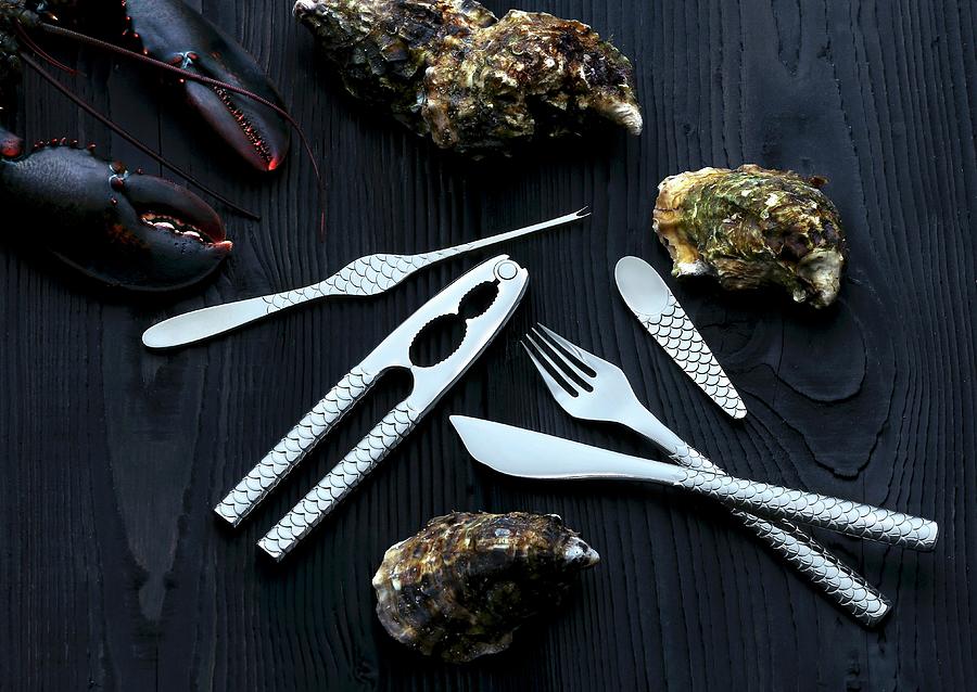 Cutlery For Fish And Seafood Next To Oysters And Lobster Photograph by Jalag / Michael Bernhardi