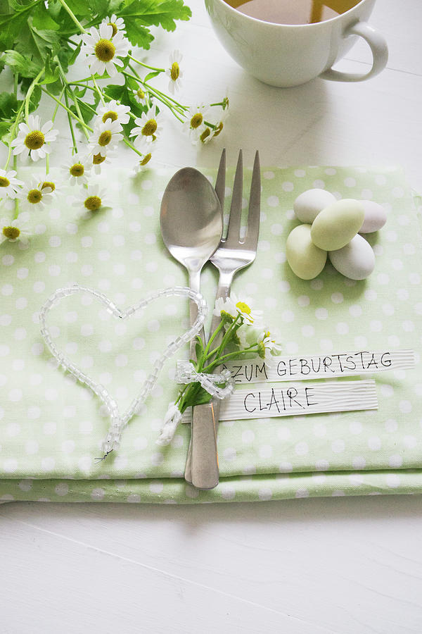 Cutlery With Chamomile Flowers And A Glass Bead Heart For A Birthday Photograph by Martina Schindler