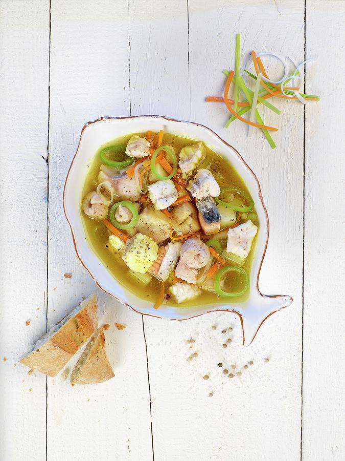 Cuxhavn Fish Soup In A Fish Plate On A Rustic Surface Photograph by Wolfgang Pfannenschmidt
