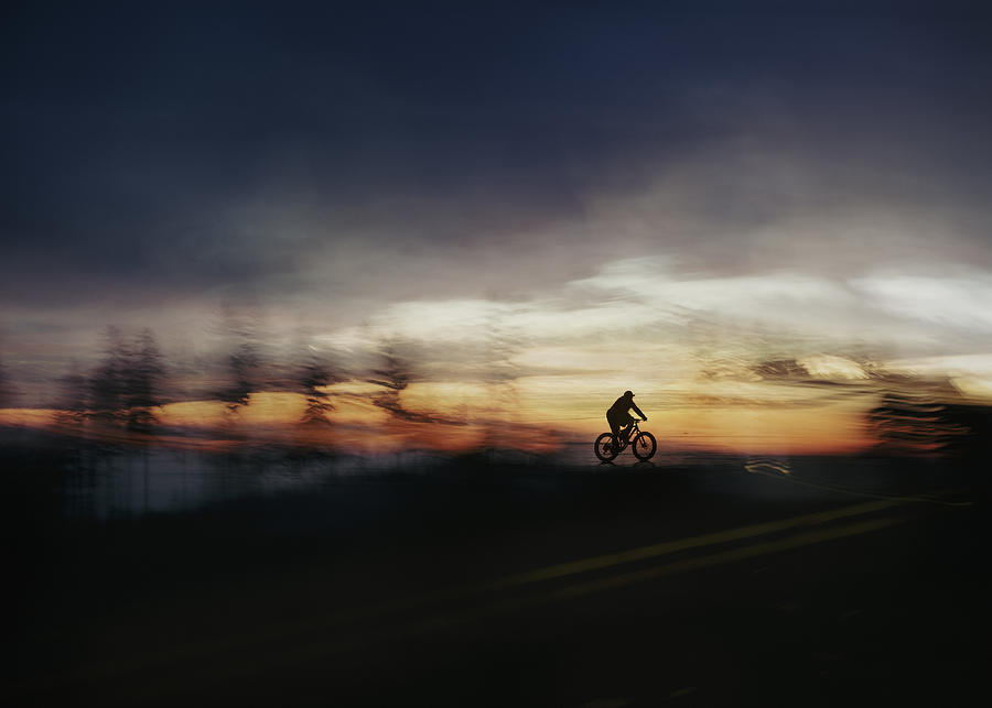Cycling In Dusk Photograph by Shenshen Dou