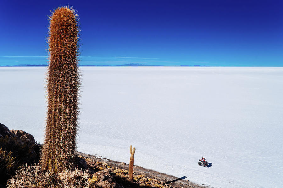 Cycling in Salar de Uyuni salt flats in Bolivia Photograph by Kamran Ali