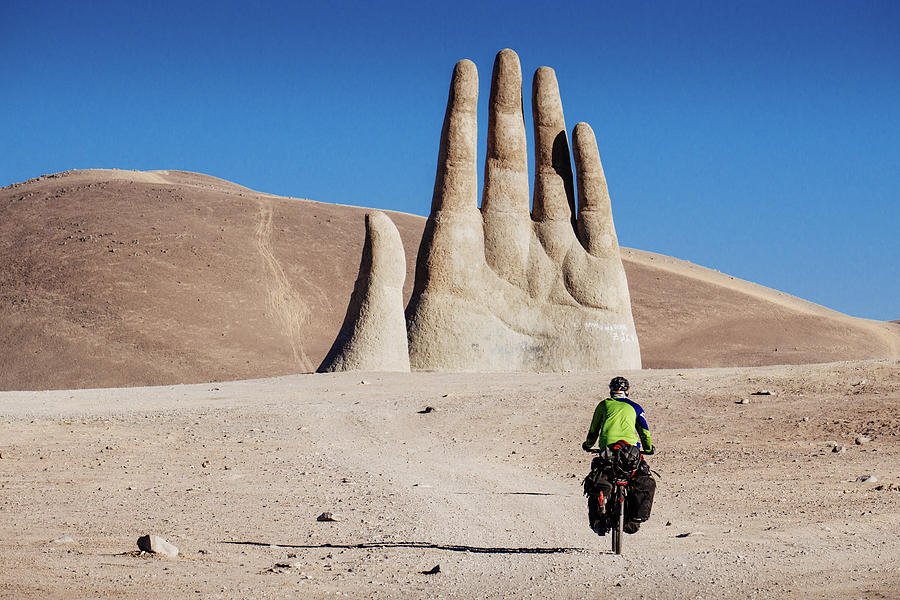 Cyclist heading to Hand of the Desert in Atacama Desert, Chile Photograph by Kamran Ali