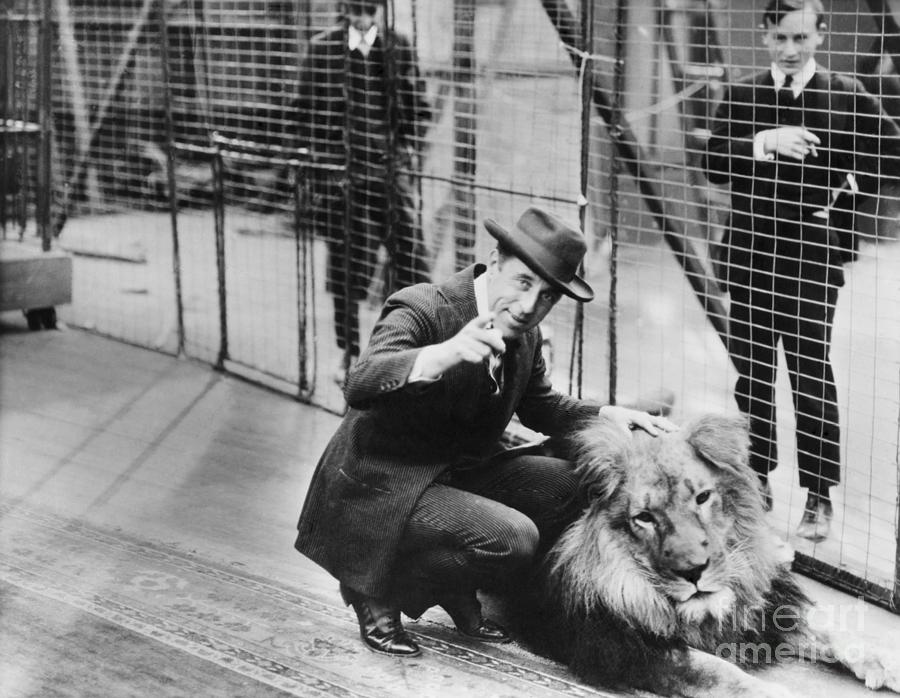 D. W. Griffith Directing A Lion Photograph by Bettmann