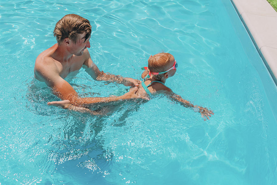 Dad Teaches Two Year Old Daughter To Swim In The Outdoor Pool Photograph By Cavan Images Liza 3418