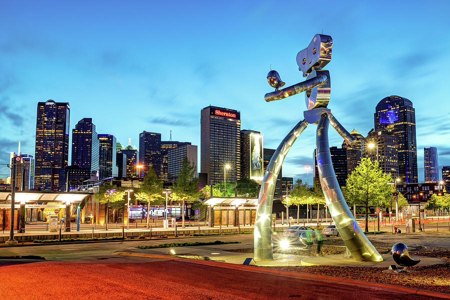 Dallas Skyline and Walking Tall Traveling Man at Dusk Photograph by Gregory Ballos