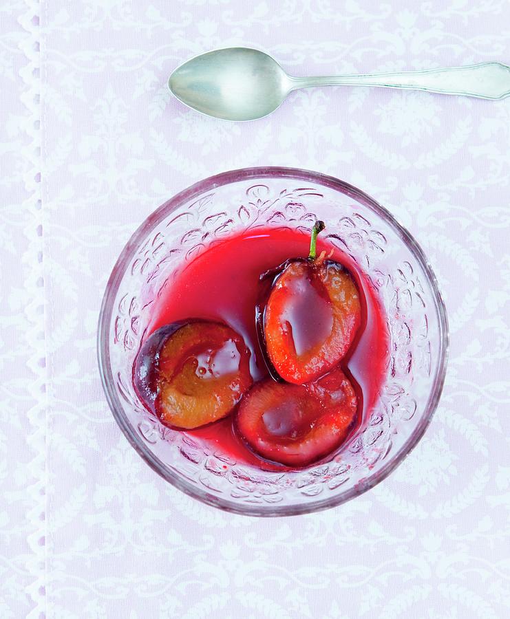 Damson Compote In A Glass Bowl seen Above Photograph by Udo Einenkel