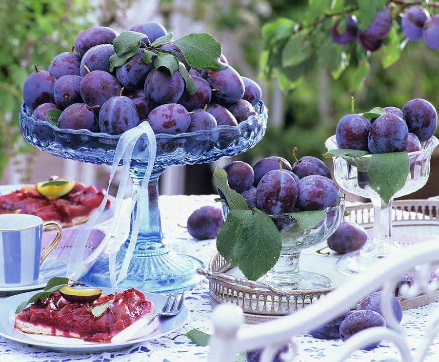 Damsons And Damson Cake On Table Out Of Doors Photograph by Strauss, Friedrich