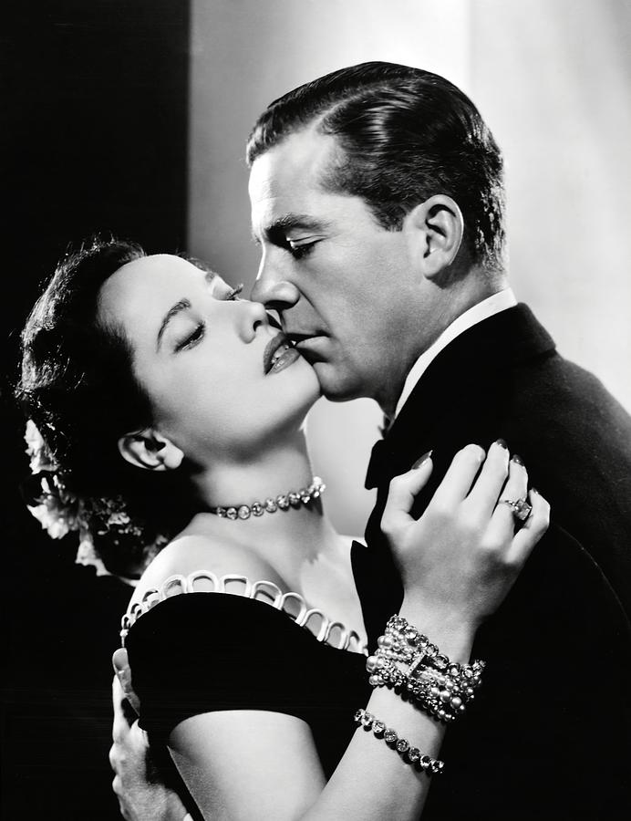 DANA ANDREWS and MERLE OBERON in NIGHT SONG -1947-. Photograph by Album