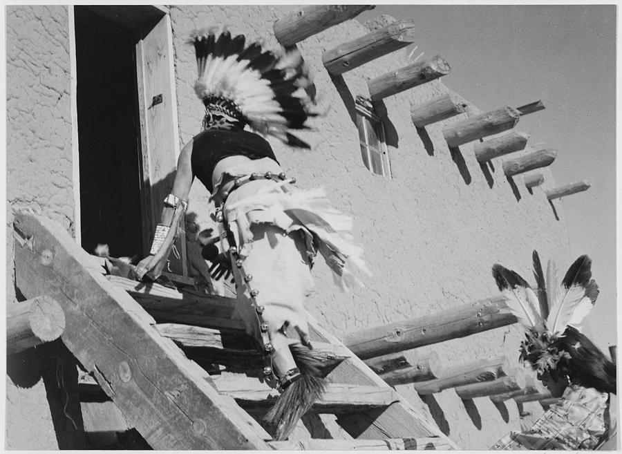Dance San Ildefonso Pueblo New Mexico 1942 two Indians in headdress ascending stairs to house. 1942 Painting by Ansel Adams