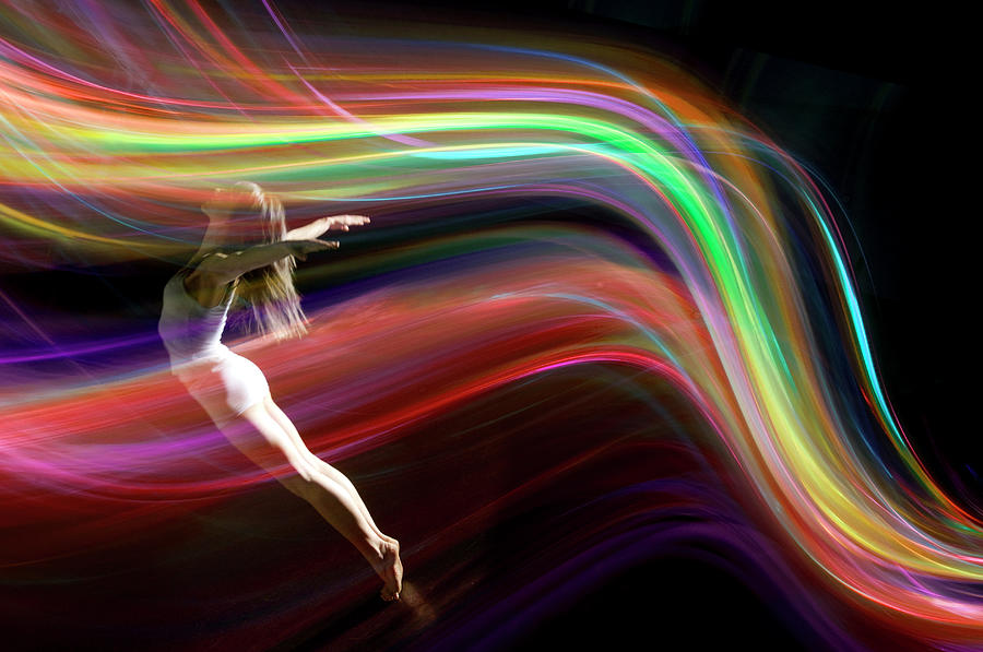 Dancer Balancing In Multicolored Photograph by John Rensten