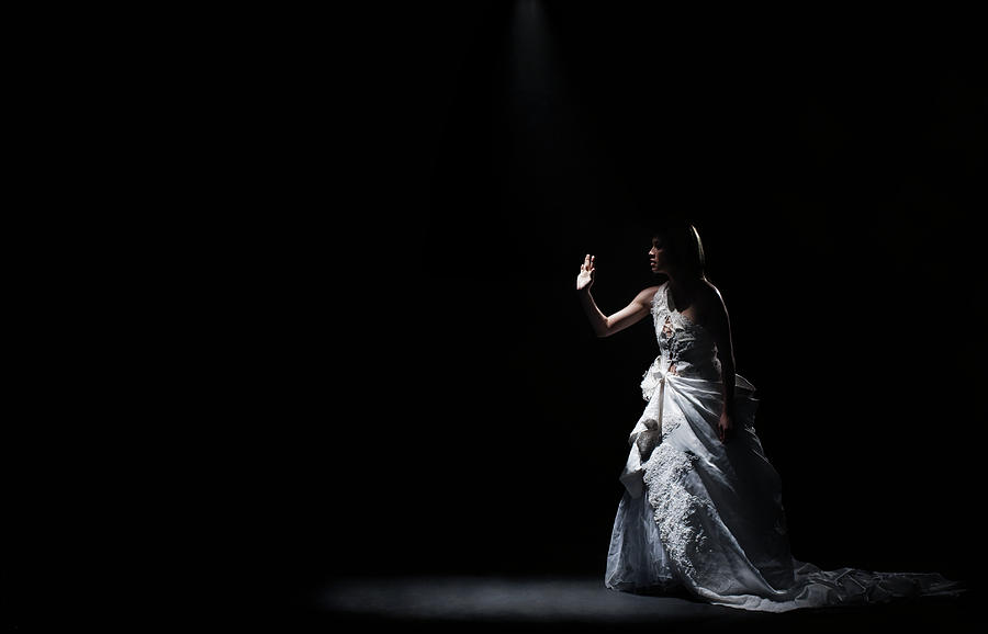 Dancer In Gown Under Spotlight On Stage Photograph by Patrik Giardino