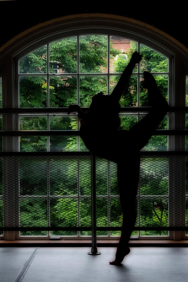 Dancer move in front of curved window Photograph by Dan Friend