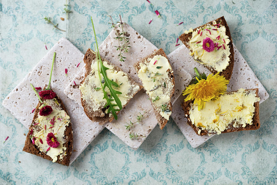 Dandelion And Daisy Butter, Thyme Butter, And Dandelion Butter On Slices Of Bread Photograph by Mandy Reschke