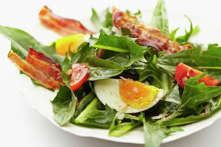 Dandelion Leaf Salad With Tomatoes, Hard-boiled Eggs And Fried Bacon Photograph by Herbert Lehmann