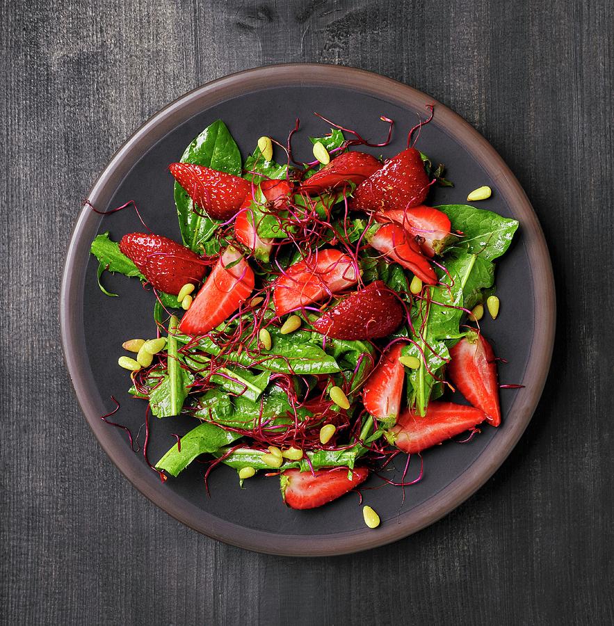 Dandelion Salad With Strawberries, Beetroot Sprouts And Pine Nuts Photograph by Maris Zemgalietis