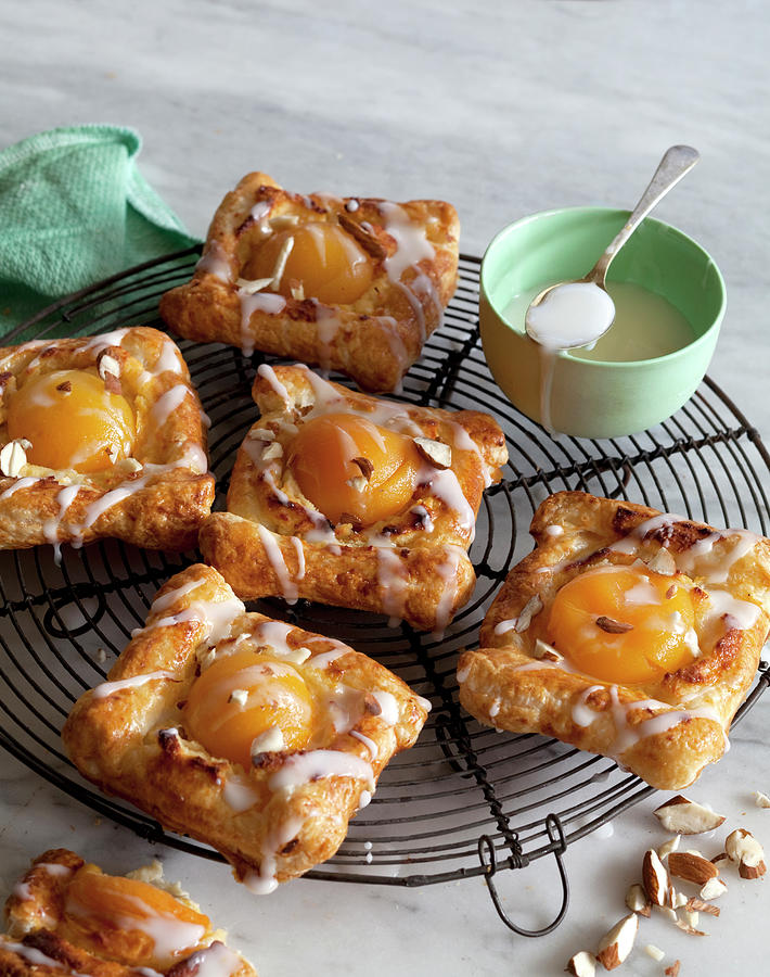 Danish Pastries With Apricots And Icing Photograph by Louise Hammond