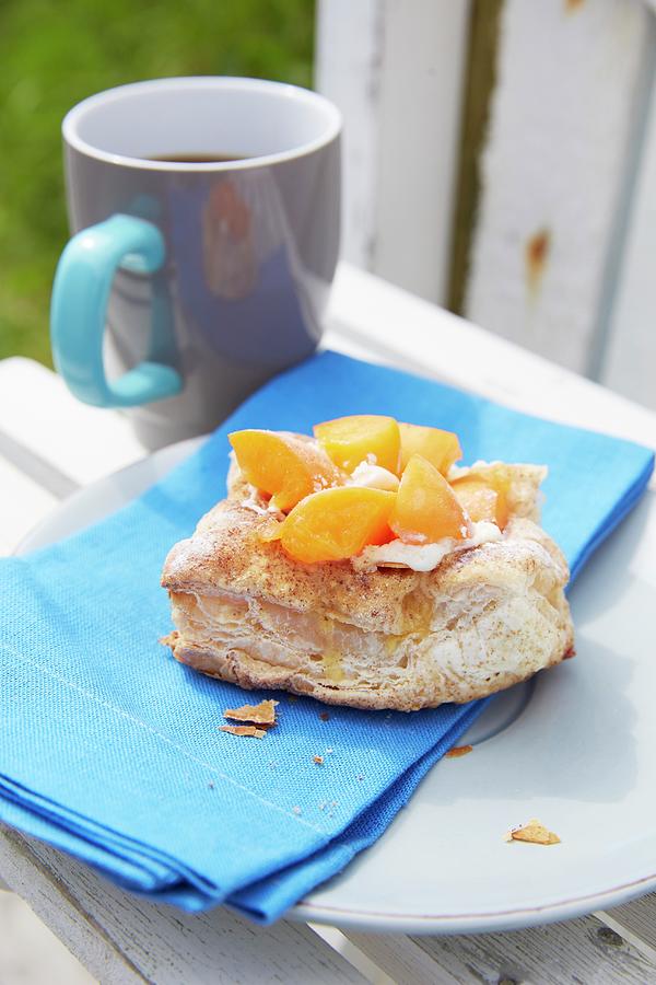 Danish Pastry With Apricots And Blue Napkin On Plate Photograph by Greenhaus Press