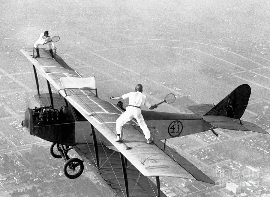 Daredevils Playing Tennis On A Biplane Photograph by Bettmann