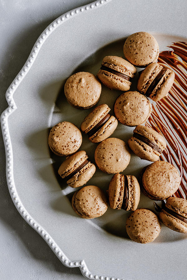 Dark Chocolate And Hazelnut Macarons Photograph by Alla Machutt
