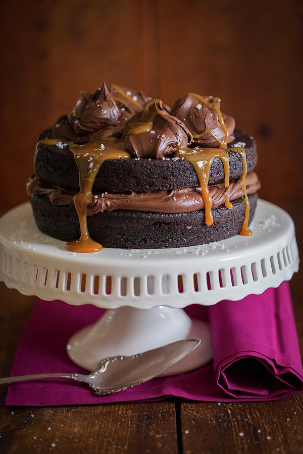 Dark Chocolate Cake With Chocolate Caramel Frosting And Seasalt Photograph by Eising Studio