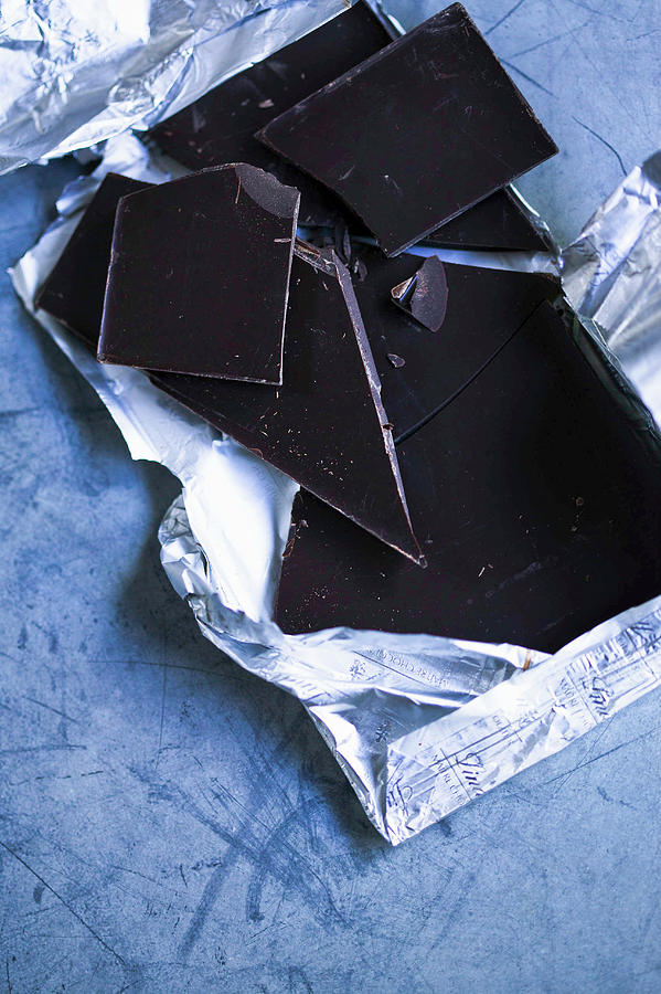Dark Chocolate In Foil On Zinc Surface Photograph by Karen Thomas