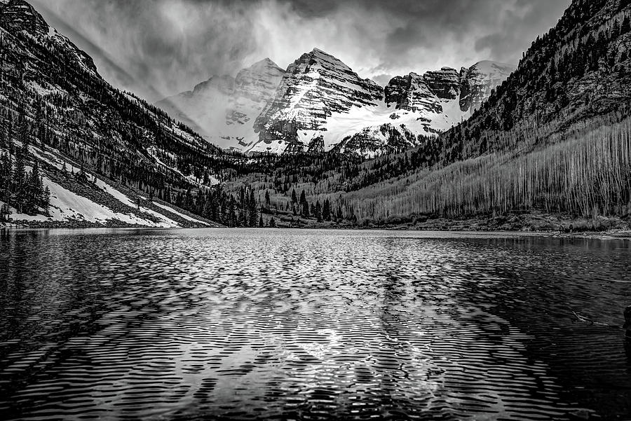 Dark Clouds Falling on The Maroon Bells - Black and White Photograph by Gregory Ballos