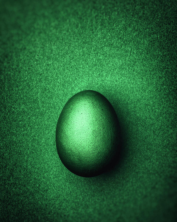 Dark Green Easter Egg On A Dark Green Background Photograph by Peter Rees