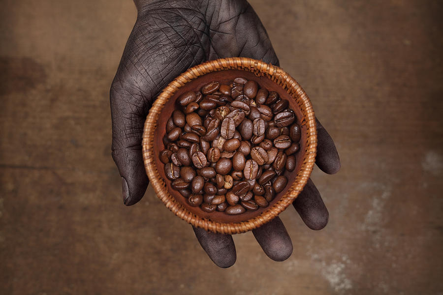 Dark Hand Holding Coffee Beans In Photograph by Narvikk