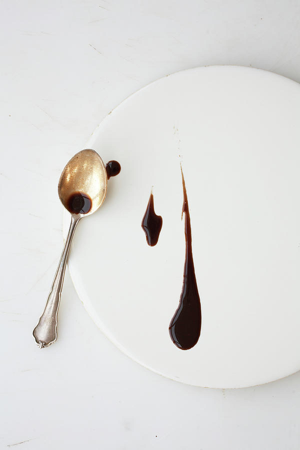 Still Life Photograph - Dark Sauce On Plate With Spoon by Jalag / Wolfgang Schardt