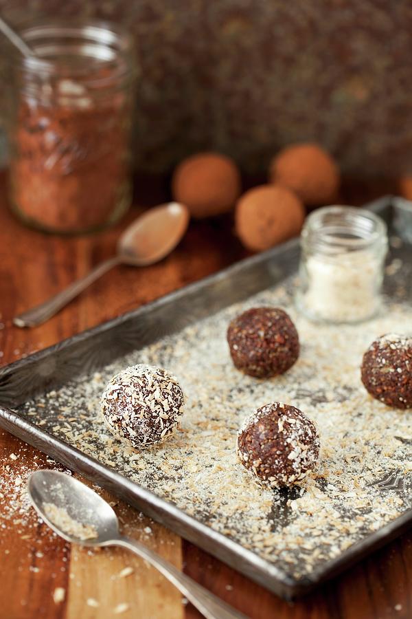 Date Energy Balls Being Rolled In Desiccated Coconut Photograph by Jane Saunders