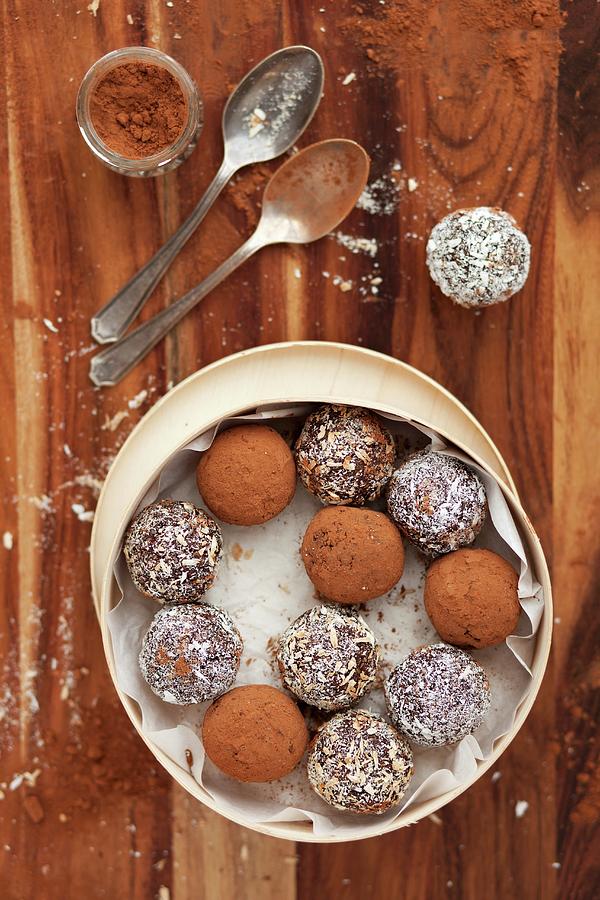 Date Energy Balls Rolled In Cocoa Powder And Desiccated Coconut Photograph by Jane Saunders