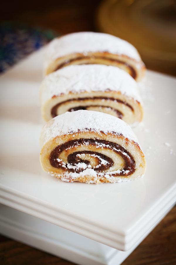 Date Filled Jelly Roll Dusted With Powdered Sugar; Sliced Photograph by Tieuli, Anthony