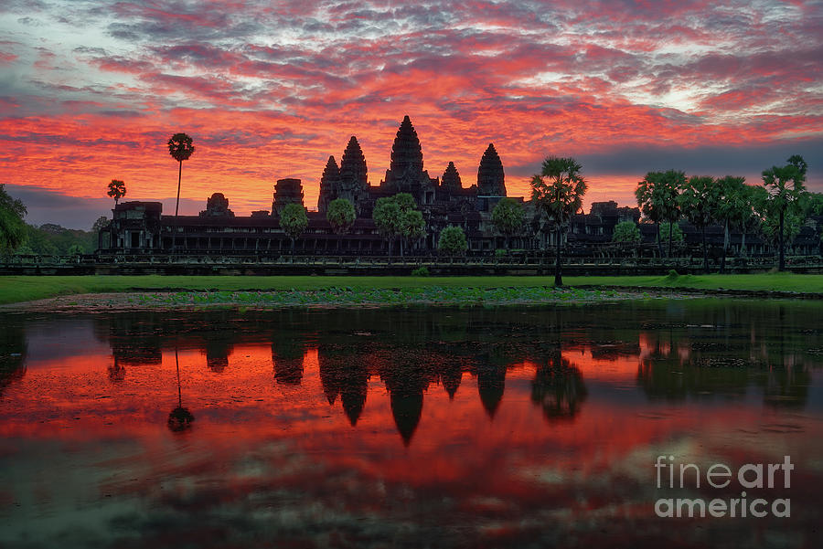 Angkor Wat Temple Reflecting in Pond at Sunrise Photograph by Tom Schwabel