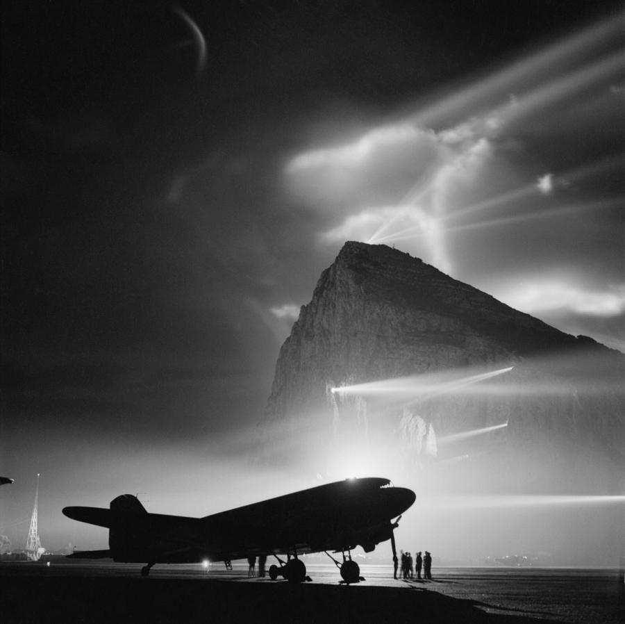 Airliner Silhouetted by Searchlights - Rock of Gibraltar - WW2 Photograph by War Is Hell Store