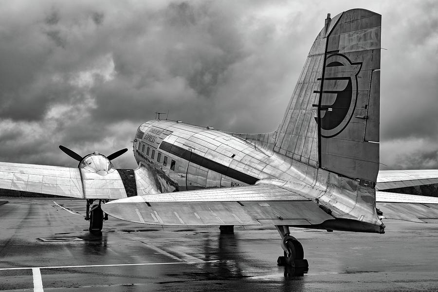 DC-3 Under a Stormy Sky Photograph by Chris Buff