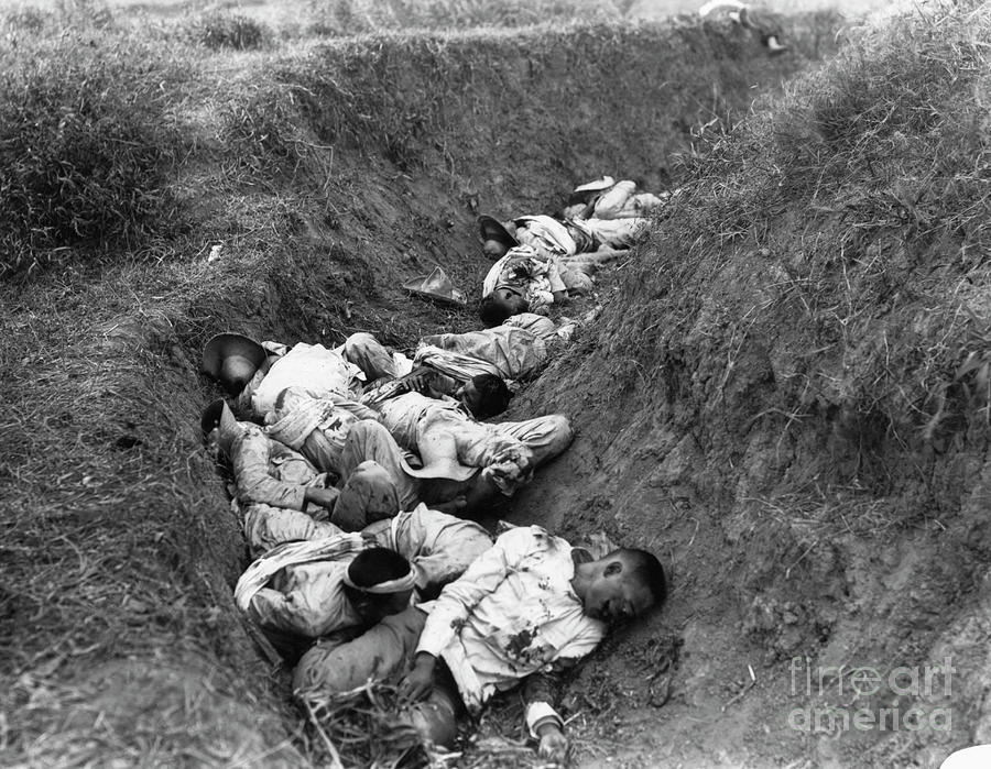 Dead Insurgents In Trench Photograph by Bettmann