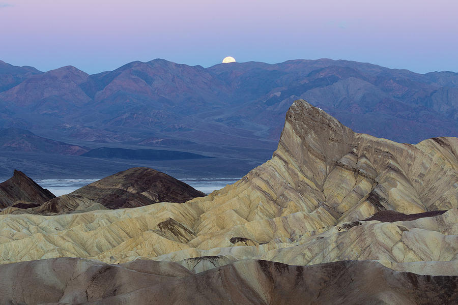 Death Valley Full Moon at Zabriskie Badlands Photograph by Bill