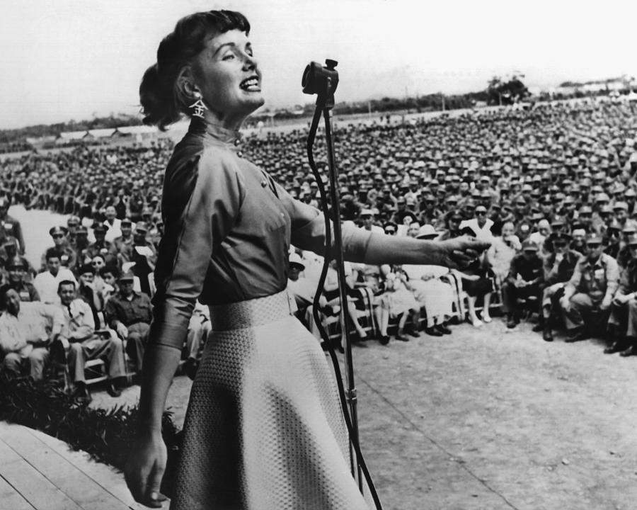 Debbie Reynolds Photograph - Debbie Reynolds Singing For Soldiers by Globe Photos