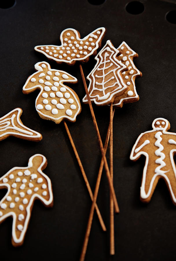 Decorated Gingerbread Shapes On Wooden Skewers Photograph by Lykke Foged & Morten Holtum