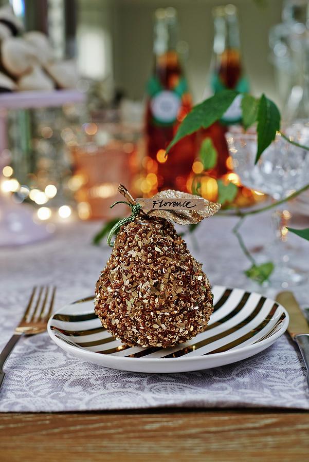 Decorated Pear With Name Tag As Festive Table Ornament On Black And White Plate Photograph by Catherine Gratwicke