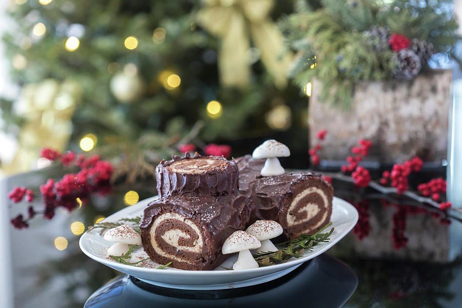 Decorated Yule Log With Christmas Tree In The Background Photograph by