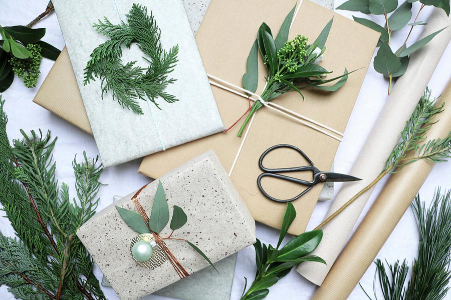 Decorating Christmas Presents With Twigs And Leaves Photograph by Marij Hessel