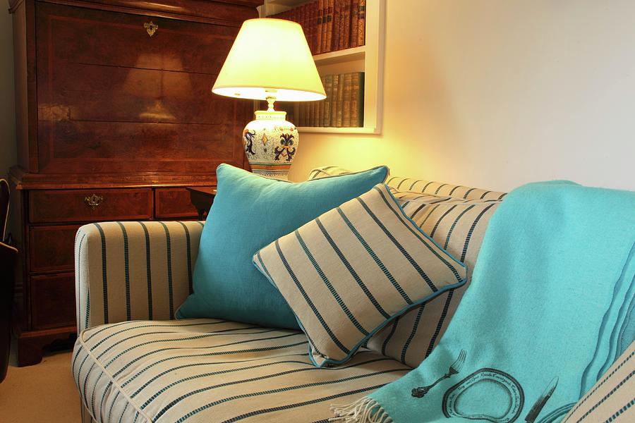 Decorative Cushions On A Sofa With A Striped Cover Photograph by Steven Morris