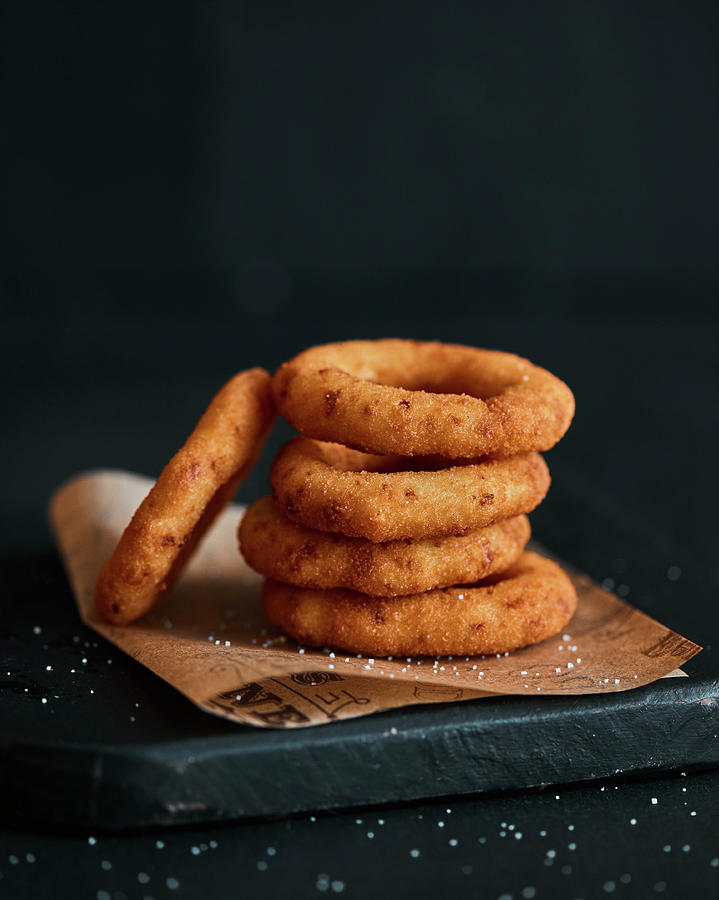 Deep-fried Onion Rings, Sprikled With Salt In A Dark Mood Photograph by Miha Lorencak