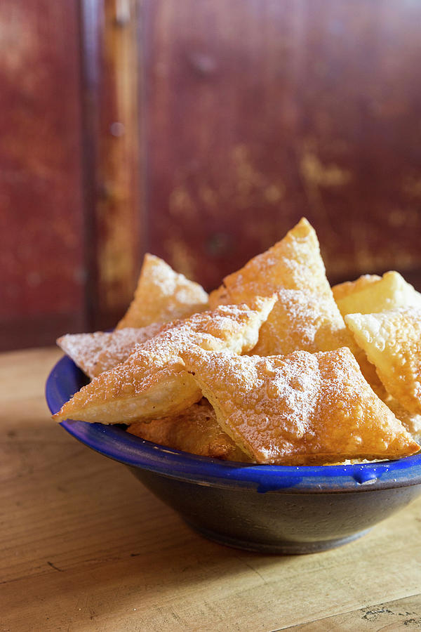 Deep-fried Pastries In A Blue Bowl Photograph by Anneliese Kompatscher