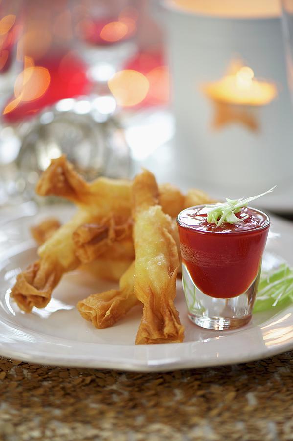 Candy Photograph - Deep-fried Prawn Rolls With A Spicy Dip by Winfried Heinze