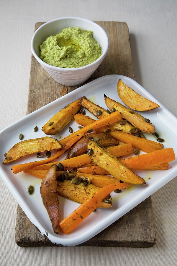 Deepfried Sweet Potato Wedges With Houmous Photograph by Joy Skipper