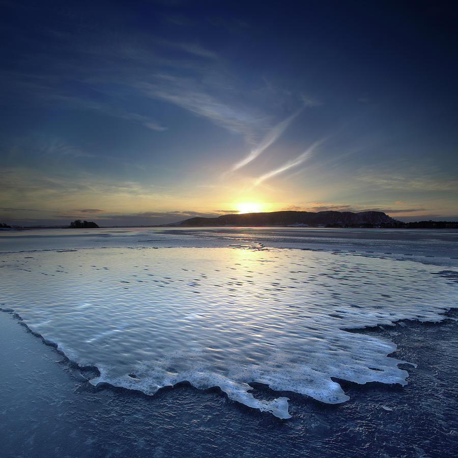 Deep Frozen Lake At Dawn With Ice Crust Photograph by Angus Clyne