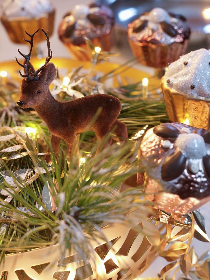 Deer Figurine And Cake-shaped Ornaments In Dish With Fairy Lights Photograph by Matteo Manduzio